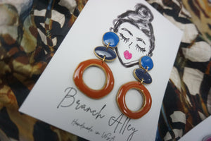 Color block in Royal, navy, rust with gold