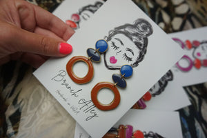 Color block in Royal, navy, rust with gold
